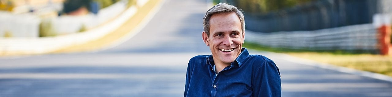 Man Sitting on Road and smiling