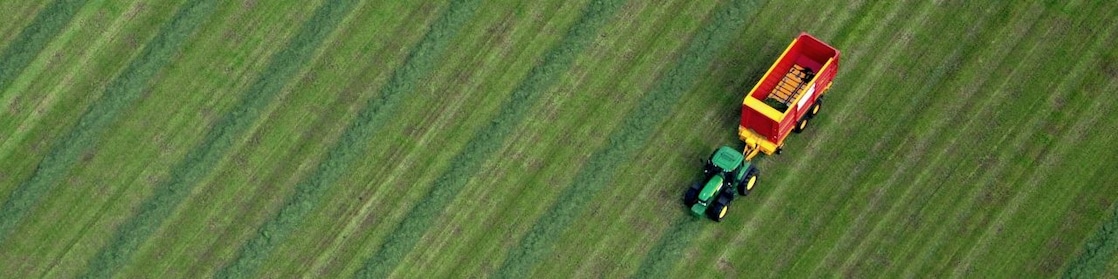 Tractor cutting grass