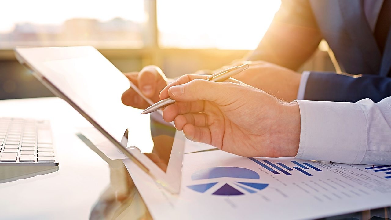office worker reviewing on tablet