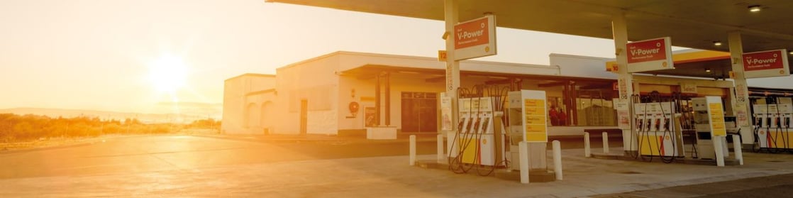 The forecourt of a shell service station at dusk