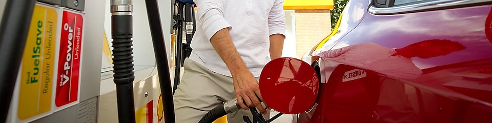 man refueling car at petrol pump