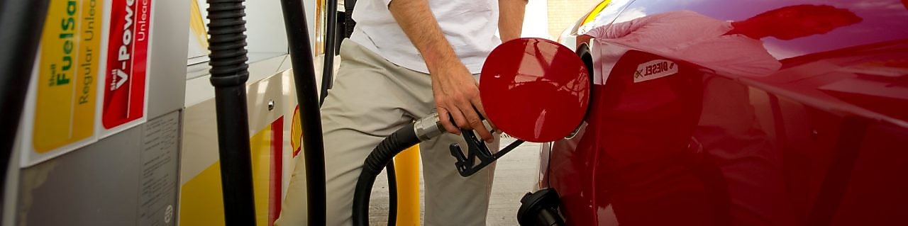 man refueling car at petrol pump